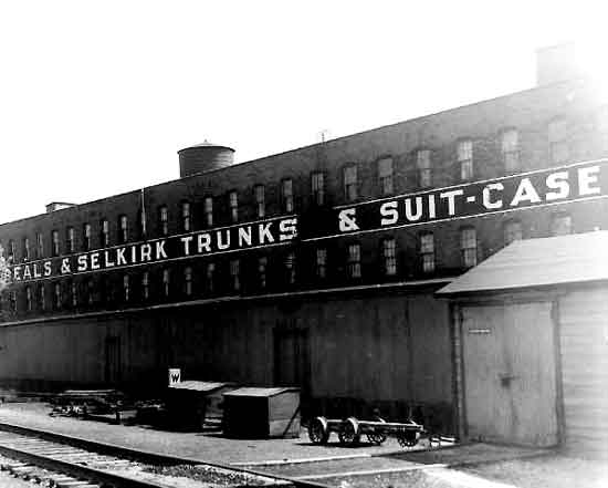 Beals And Selkirk Trunk Factory located at the railroad tracks on Sixth